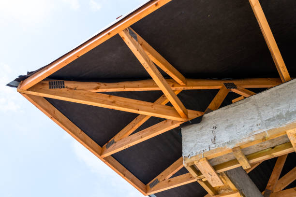 istock Roof trusses covered with a membrane on a detached house under construction, visible roof elements, battens, counter battens, rafters. 1167804891