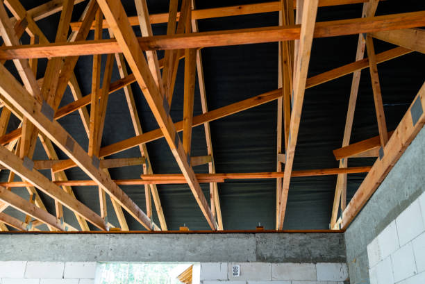 istock Roof trusses covered with a membrane on a detached house under construction, visible roof elements, battens, counter battens, rafters. 1167804924