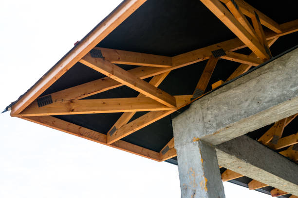 istock Roof trusses covered with a membrane on a detached house under construction, visible roof elements, battens, counter battens, rafters. 1167805338