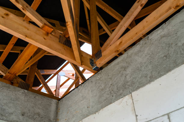 istock Roof trusses covered with a membrane on a detached house under construction, visible roof elements, battens, counter battens, rafters. 1167805546