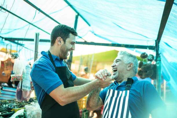 Street market's salesmen celebrating