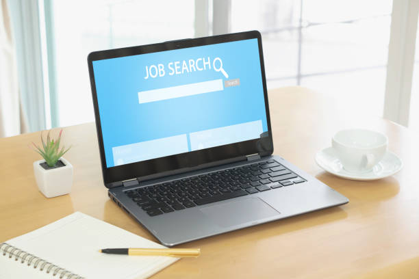 istock Online job search engine on laptop on wood table 1167809739