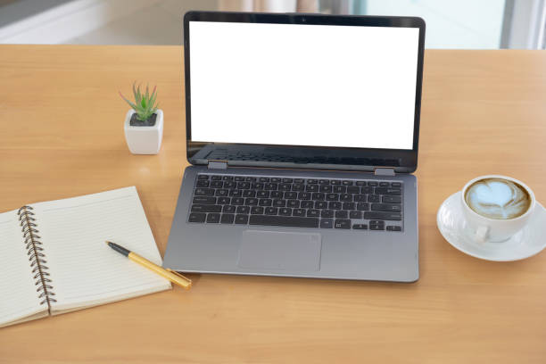 istock Mockup laptop on table wood. 1167810401