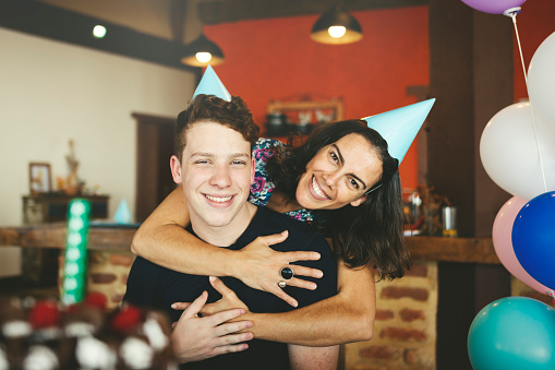 Mom and son together celebrating a birthday party