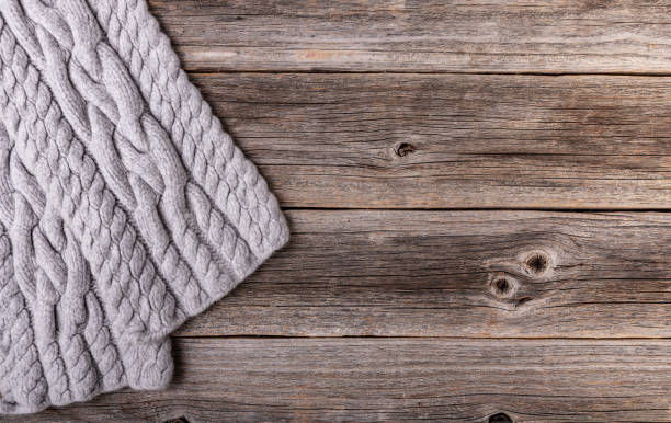 istock Winter scarf on a wooden background. 1167813644