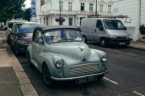 London / UK - July 16, 2019: 1949 Morris Minor MM tourer with hood and flexible side curtains erected on a street of London