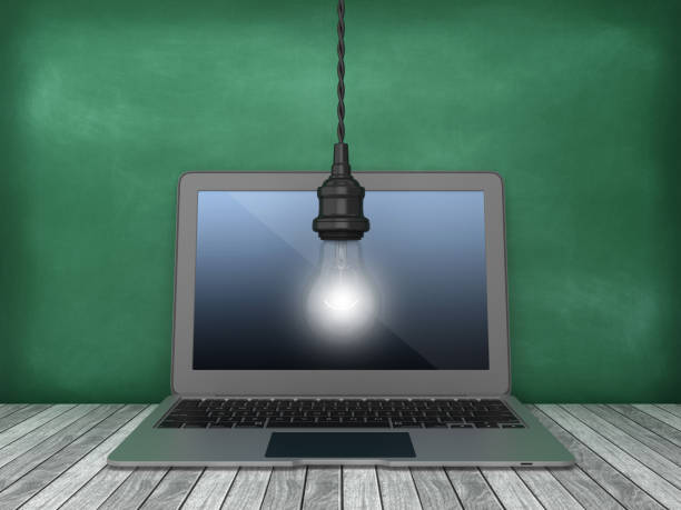 istock Laptop with Light Bulb on Chalkboard Background - 3D Rendering 1167814649