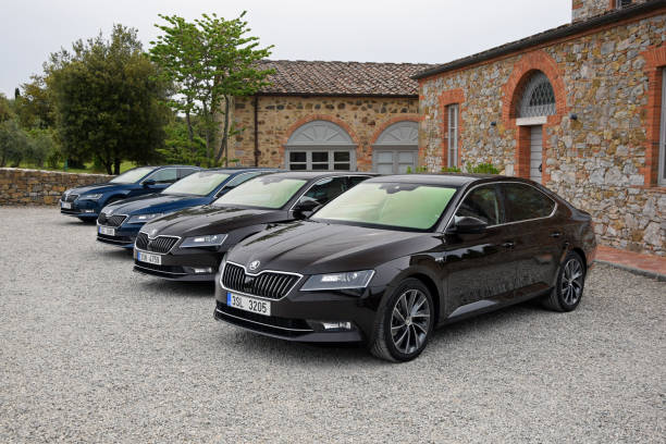 Siena, Italy - 15th May, 2015: Skoda Superb vehicles parked on the parking before the drives. The Superb is the most luxury car in Skoda offer.