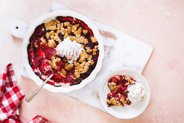istock Summer berry crumble in baking dish and a portion on plate 1167817713