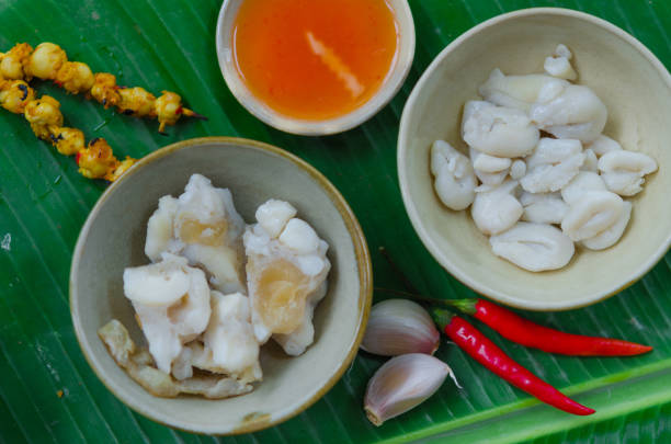 istock Phan Thiet street foods made from squid: grilled squid cake, steamed squid's egg and fried squid's mouth - Rang muc nuong 1167817901