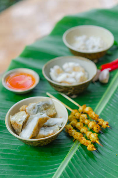 istock Phan Thiet street foods made from squid: grilled squid cake, steamed squid's egg and fried squid's mouth - Rang muc nuong 1167817977