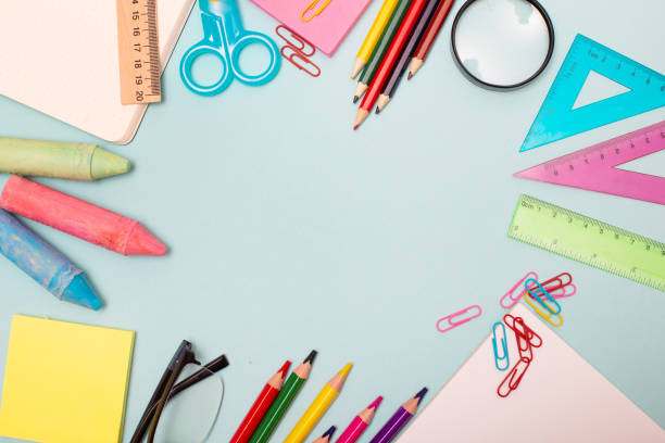 istock School supplies on blue background. Education concept, top view copy space. 1167818013