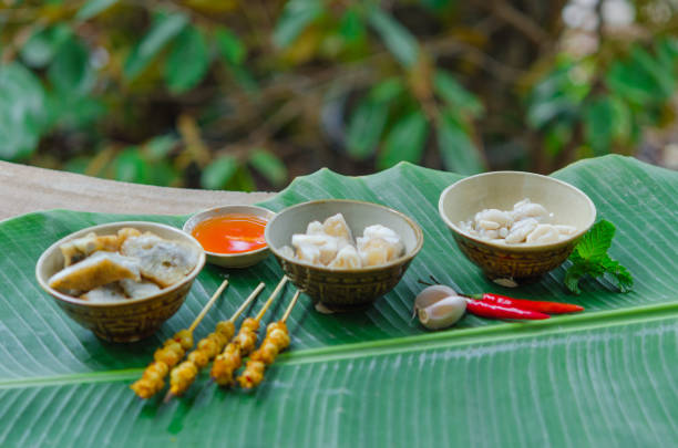 istock Phan Thiet street foods made from squid: grilled squid cake, steamed squid's egg and fried squid's mouth - Rang muc nuong 1167818040