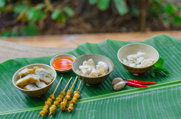 istock Phan Thiet street foods made from squid: grilled squid cake, steamed squid's egg and fried squid's mouth - Rang muc nuong 1167818044