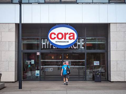 Picture of a sign with the logo of Cora on their local supermarket in Lyon, France. Cora is a retail group of hypermarkets located in France and elsewhere in Europe. Cora was founded in 1974 by the supermarket holding Louis Delhaize Group