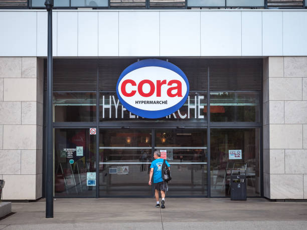Cora logo in front of their local supermarket in Lyon. Cora is a French retailer of supermarkets and hypermarkets spread in Europe, part of Delhaize stock photo