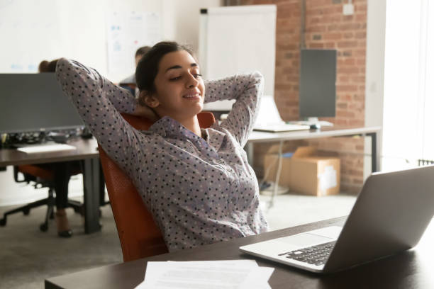 istock Indian ethnicity millennial employee relaxing in workplace completed scheduled work 1167824865