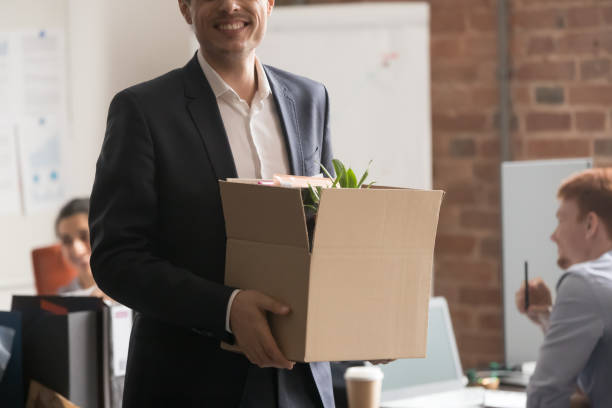 istock Cropped image happy newcomer standing holding box with belongings 1167824910