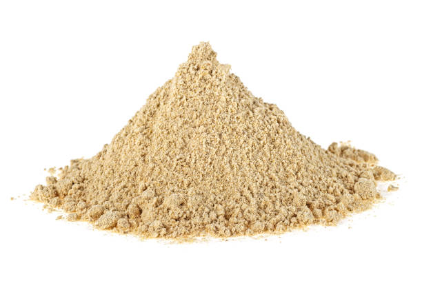 istock Heap of ginger powder isolated on white background 1167827225