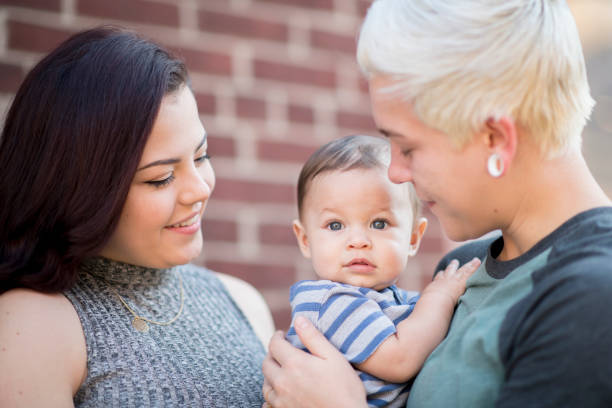 istock Same sex couple with baby 1167827516