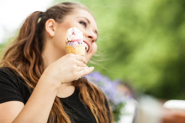 istock Young woman eating ice cream 1167828961