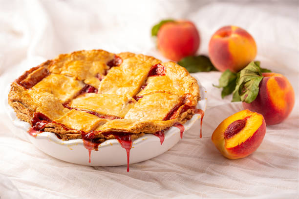 istock Freshly baked homemade peach pie in a white dish 1167830127