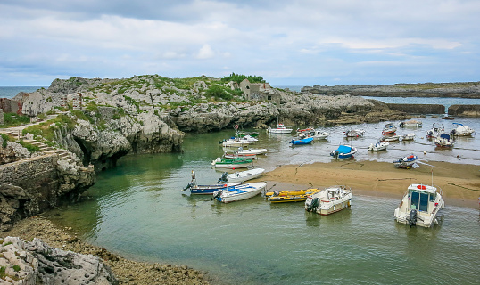 Docked boats in Islares harbour, Cantabria, northern Spain, August-03-2014