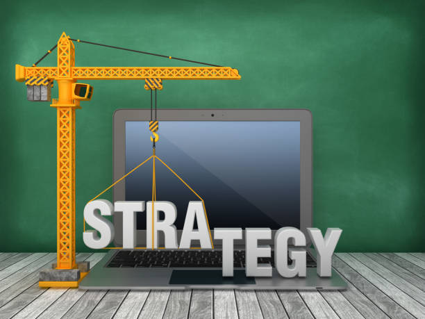 istock Tower Crane and Laptop with STRATEGY Word on Chalkboard Background - 3D Rendering 1167831512