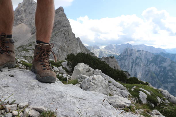 istock Hiking over rocks on a mountain trail 1167831986