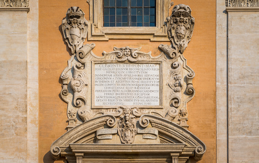 Detail with coat of arms from the facade of the Palazzo Senatorio in the Campidoglio in Rome, Italy.