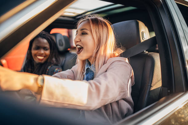 istock Friends driving in a car 1167836958