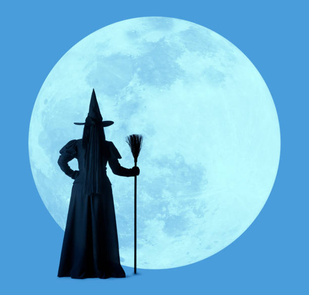 istock Halloween Witch Silhouetted By Large Full Moon 1167838175
