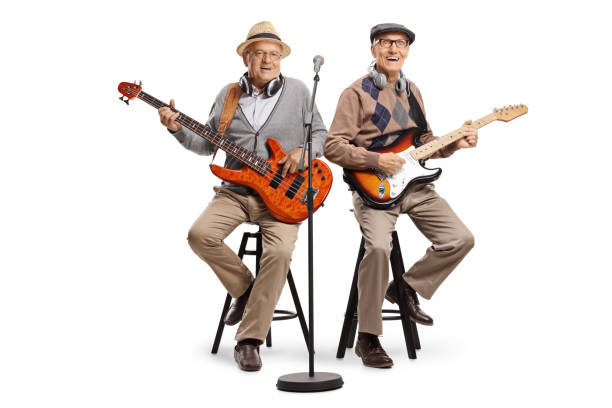 istock Two senior men sitting and playing electric guitars 1167840384