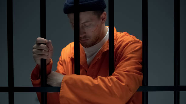 istock Upset imprisoned male leaning on bars, feeling depressed, psychological help 1167840394