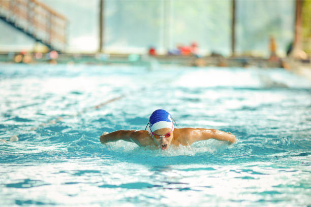 young male swimmer swimming - swimming male isolated swimming goggles imagens e fotografias de stock