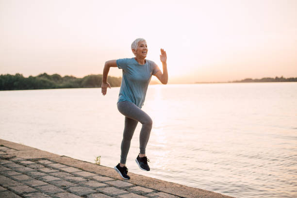istock Senior woman jogging in the dawn 1167841946