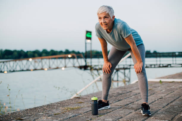istock Senior woman cooling down after running 1167841961