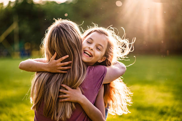 Mom hugged her little daughter in the Park