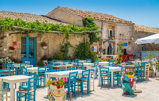 Marzamemi, in the province of Syracuse, Sicily. A summertime morning with tourists visiting and enjoing the little village. July-05-2018