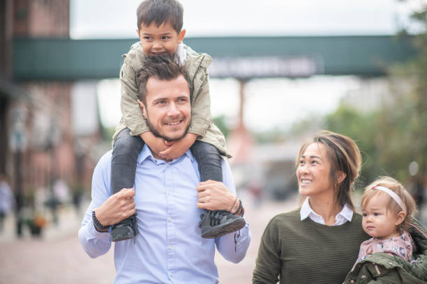 istock Family walking through the park 1167845932