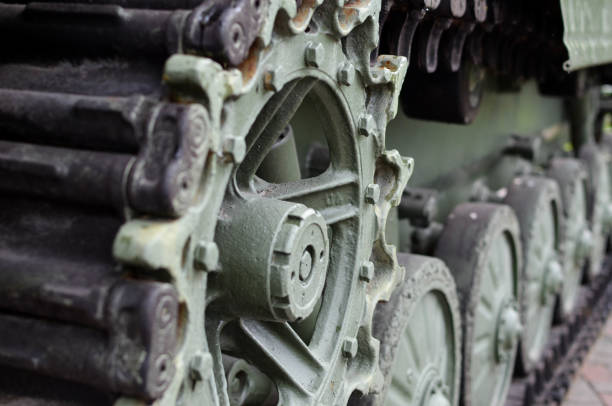 istock Tank track and wheels closeup. Blur effect. 1167846833