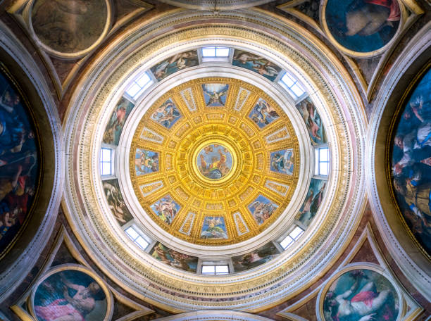 the beautiful cappella chigi designed by raffaello, in the basilica of santa maria del popolo in rome, italy. april-15-2018 - roman statue angel rome imagens e fotografias de stock