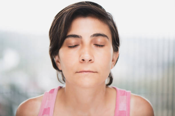 istock Woman With Eyes Closed 1167848799