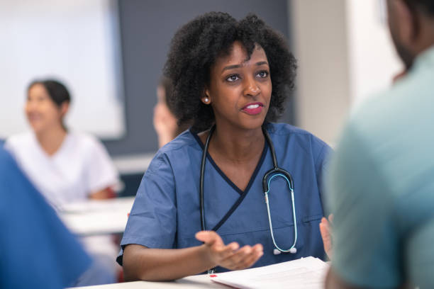 istock Female black student leads discussion in medical training course 1167849214