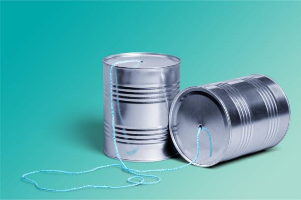 Telephone. Tin Can Phone connected with thread isolated on white string telephone stock pictures, royalty-free photos & images