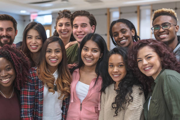 istock Multi-Ethnic Group of University Students Sitting Inside Together 1167863772