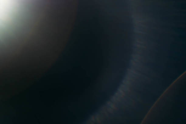 istock white lens flare dark background spotlight rays 1167863924