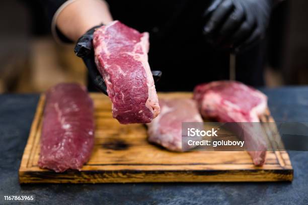 Butcher Shop Fresh Cuts Raw Beef Meat Chef Steaks Stock Photo - Download Image Now - Meat, Butcher's Shop, Butcher
