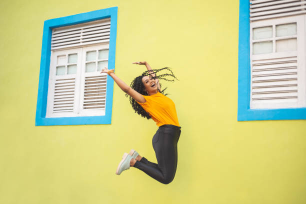 istock Afro woman jumping 1167868671