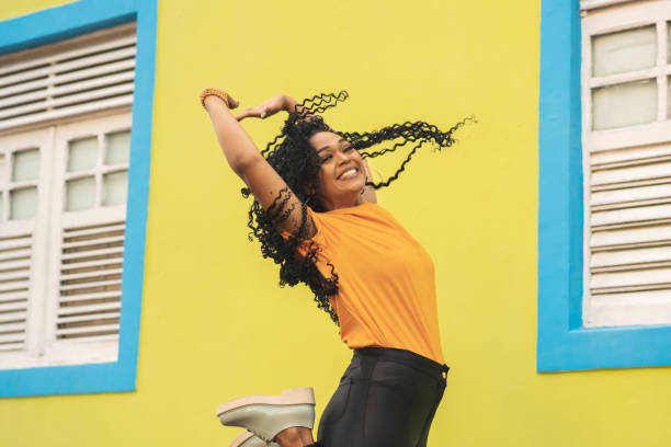 istock Woman jumping with hands up 1167868703
